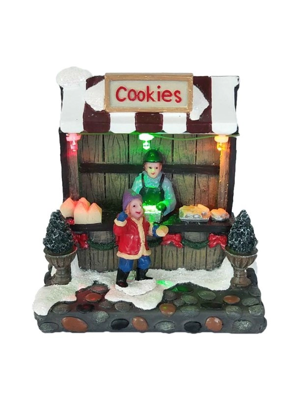 Loja de biscoitos de Natal iluminada com menino
