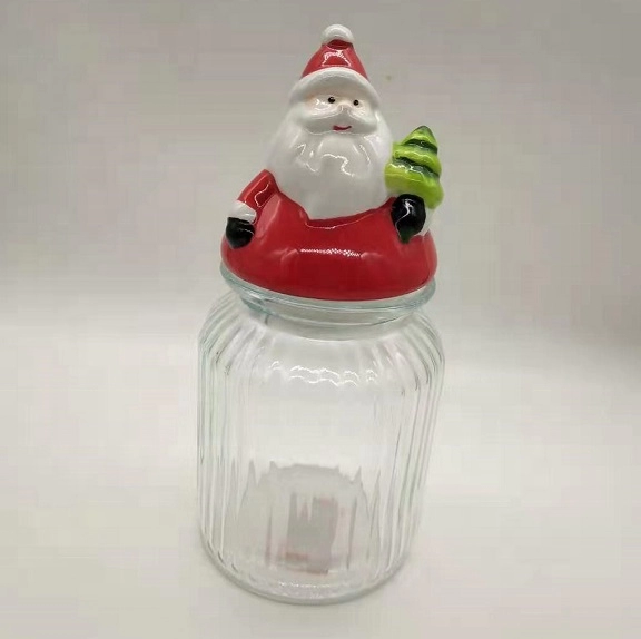 Recipiente de vidro com tampa de cerâmica em forma de Papai Noel
